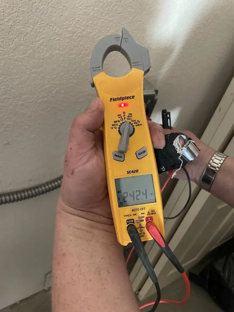 Voltage testing with clamp meter during Ceiling Fan Installation in New Hope